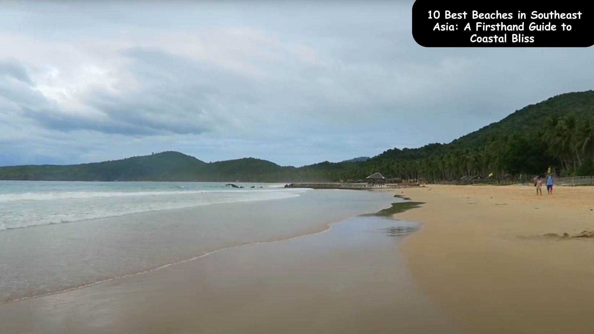 A scenic view of crystal-clear waters and white sandy beaches in Southeast Asia, showcasing one of the 10 best beaches featured in a firsthand coastal travel guide.