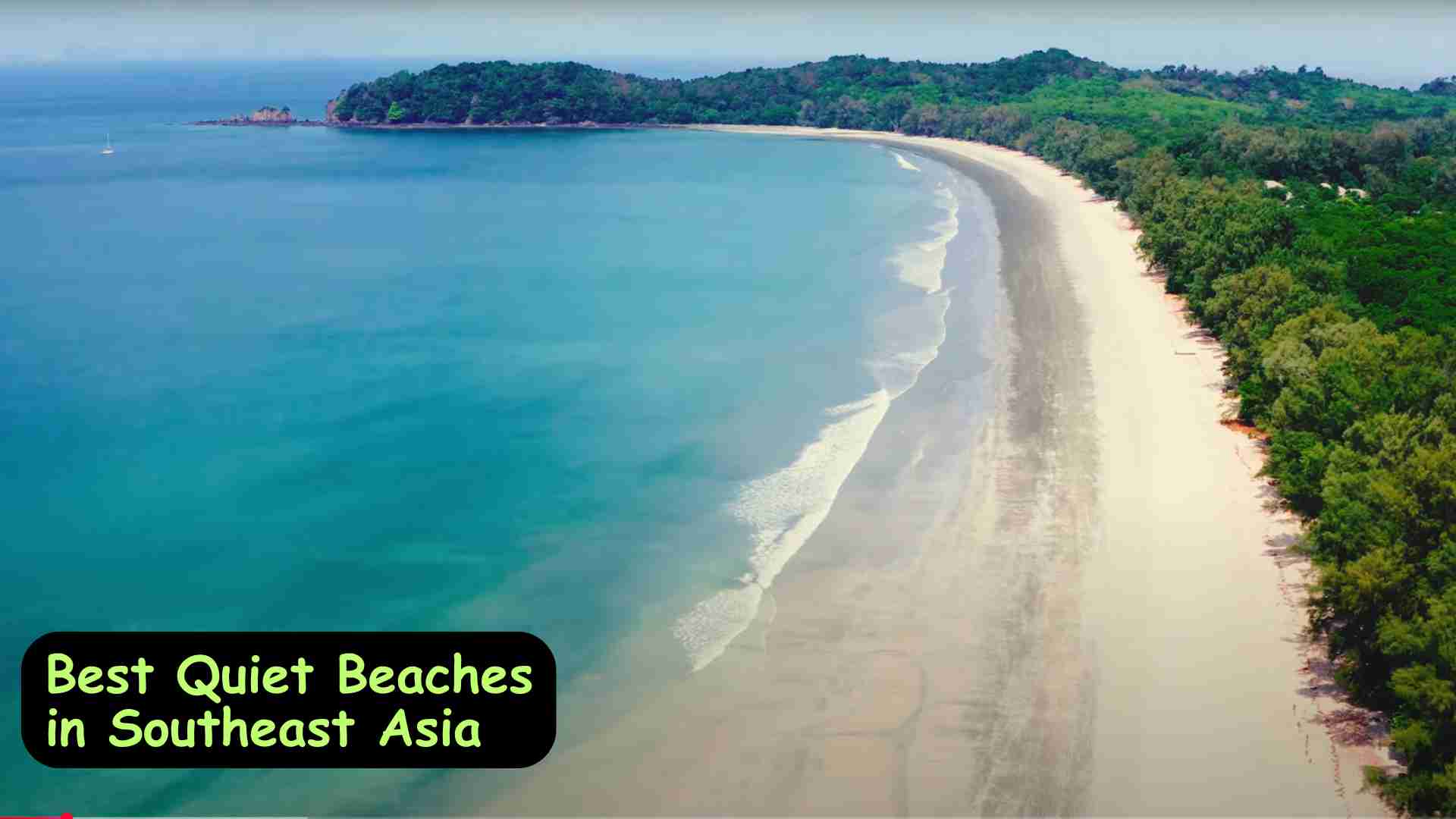 Tranquil beach with soft white sand and calm turquoise waters in Southeast Asia, perfect for a peaceful getaway.